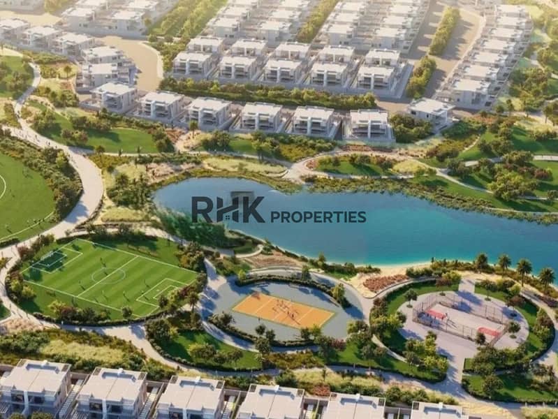 12 Aerial view of DAMAC community Dubai showing crystal lagoon beach, football pitch and sports courts