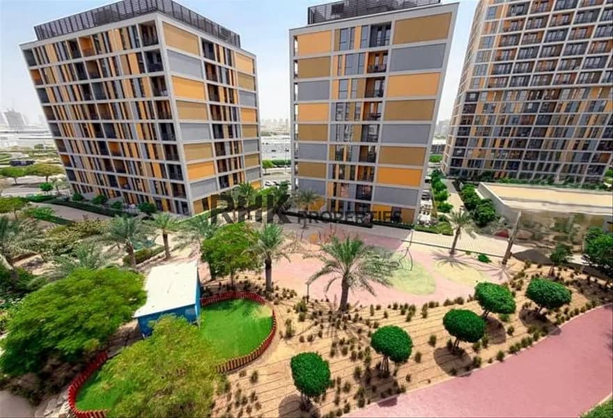 11 Noor 5 Midtown apartment buildings and landscaped courtyard in Dubai Production City
