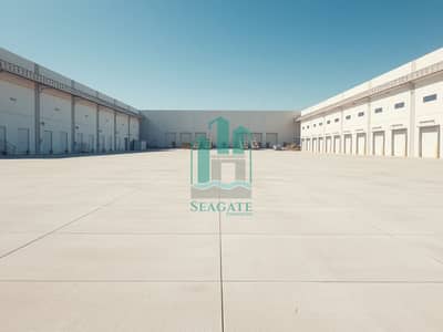 ارض صناعية  للايجار في الصجعة، الشارقة - An_empty_industrial_plot_showcasing_a_vast_open_area_with_smooth_concrete_flooring_devoid_of_any_machinery_or_equipment. _The_scene_features_large_unfurnished_warehouses_in_the_background_with_clean_modern_architectur. jpeg