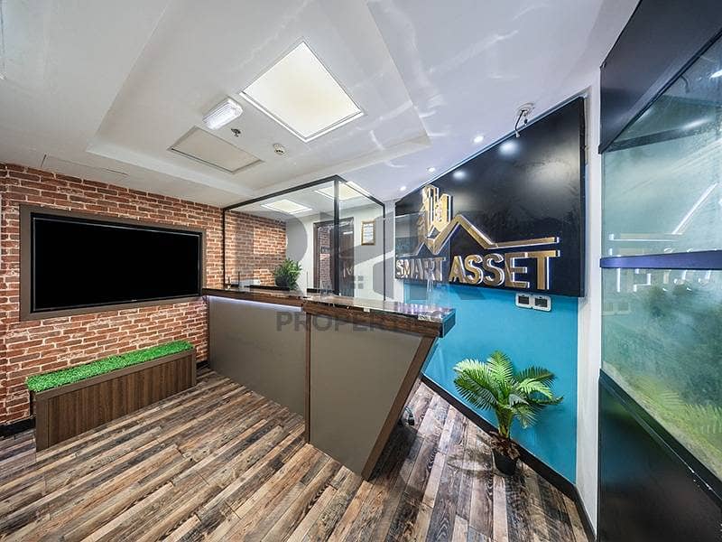 3 Modern office reception desk with branded signage in JLT commercial tower Duba