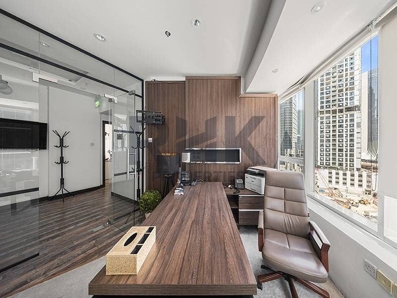 5 Fitted executive office with wooden feature wall and floor-to-ceiling windows Dubai