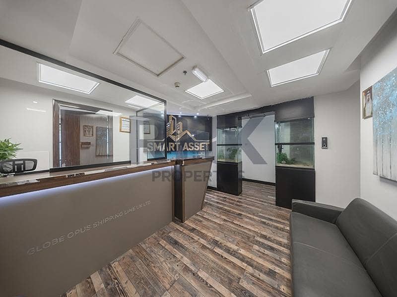 9 Office reception lobby with aquariums and marble desk in Dubai commercial tower