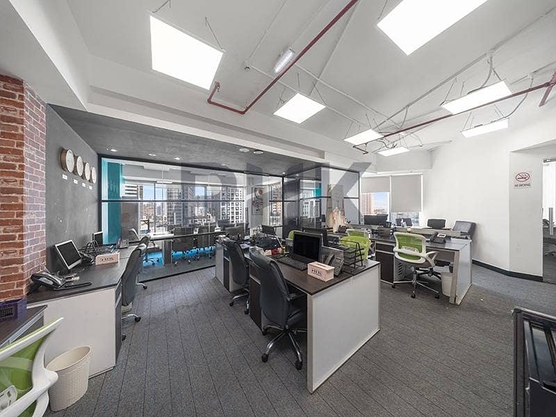 11 Open-plan office with multiple workstations and panoramic tower views JLT Dubai