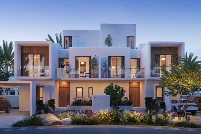 Rivana townhouses exterior facade at dusk in The Valley by Emaar Dubai Rivana townhouses exterior facade at dusk in The Valley by Emaar Dubai