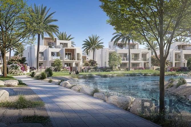 12 Rivana townhouses beside landscaped water feature and gardens at The Valley Dubai