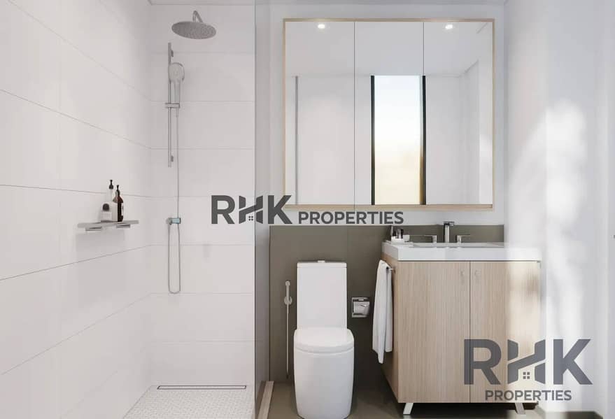 6 Ensuite bathroom with rainfall walk-in shower and vanity in The Portman by Ellington Properties, Dubai