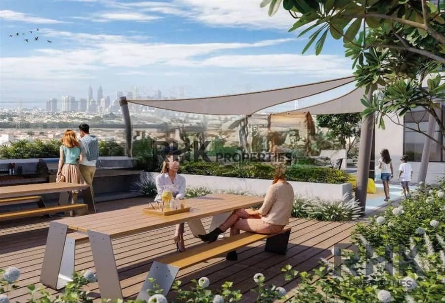 8 Rooftop terrace with BBQ seating and Dubai skyline views at The Portman by Ellington Properties