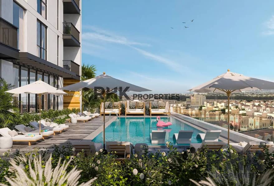 11 Outdoor swimming pool with sun loungers and community views at The Portman by Ellington Properties, Dubai