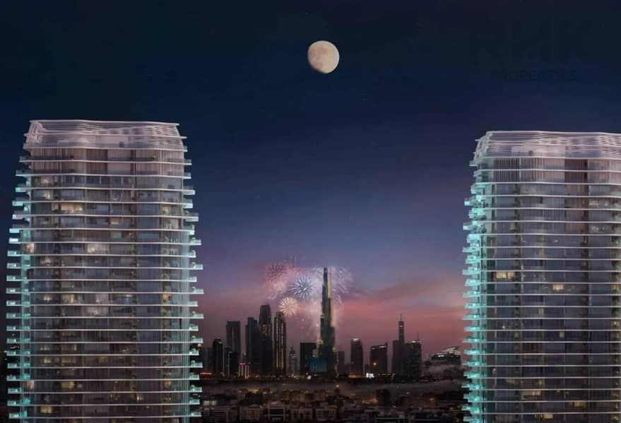 8 Twin luxury towers at dusk overlooking Dubai skyline and Burj Khalifa