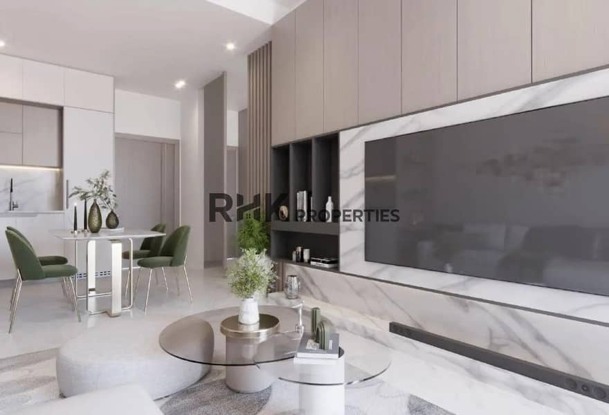 2 Contemporary living room with marble TV feature wall, built-in shelving, and open-plan kitchen in Dubai residential apartment