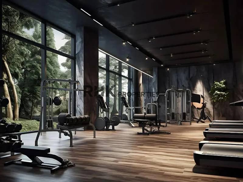 8 State-of-the-art residents gym with floor-to-ceiling windows, free weights and cardio machines in Red Square Dubai