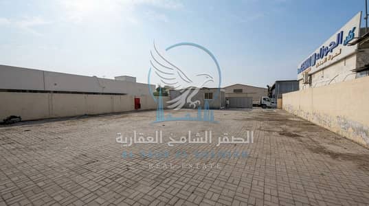 Mixed Use Land for Rent in Industrial Area, Sharjah - Yard Behind Shops in Industrial Area 5. jpeg
