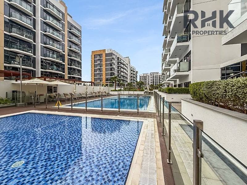 4 Swimming pools and sun deck amenities at Azizi Riviera residential community in Meydan, Dubai