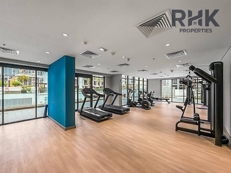 6 Fully equipped gym with treadmills and weight machines at Azizi Riviera 41, MBR City