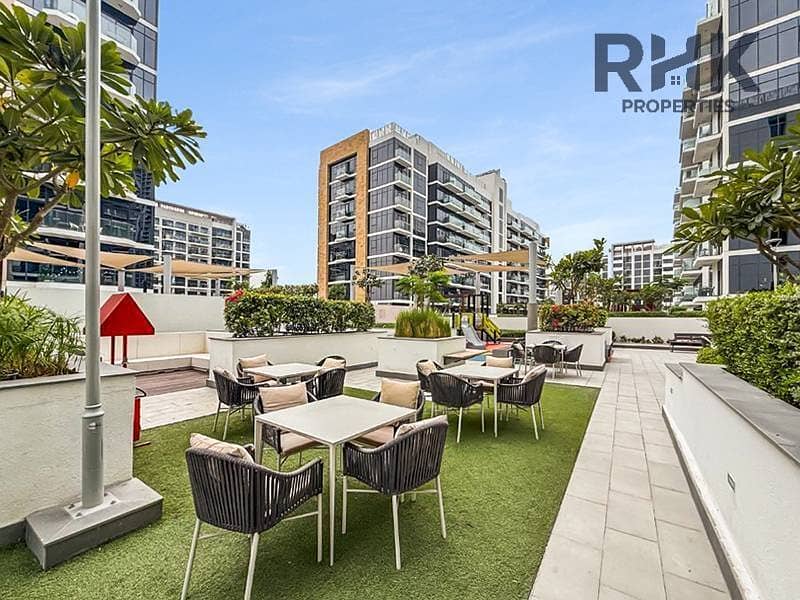10 Landscaped garden seating and dining terrace at Azizi Riviera residential towers, MBR City