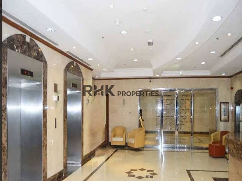 3 Ontario Tower lobby with elevators and marble flooring in Business Bay Dubai
