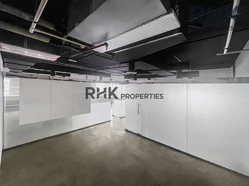 4 Fitted office for rent in Ontario Tower Business Bay with glass partitions and exposed ceiling