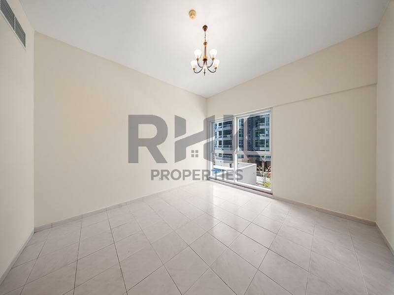 2 Spacious bedroom with large window and community view in Dubai Marina residence