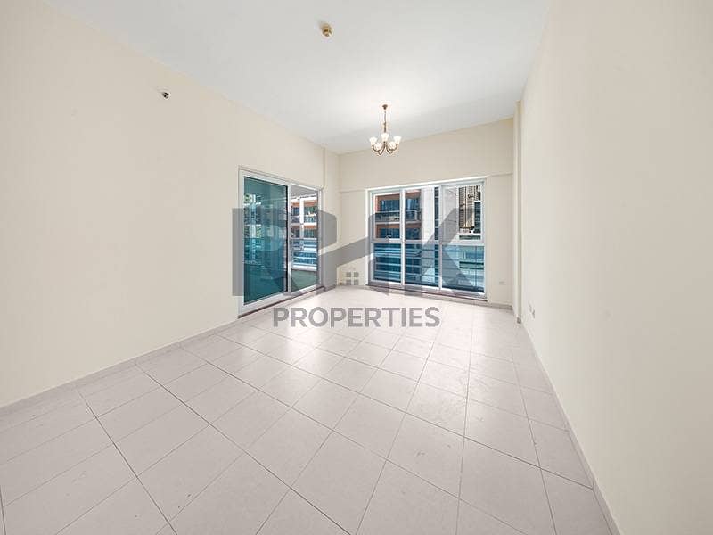 4 Bright living room with dual windows and balcony in Dubai Marina apartment