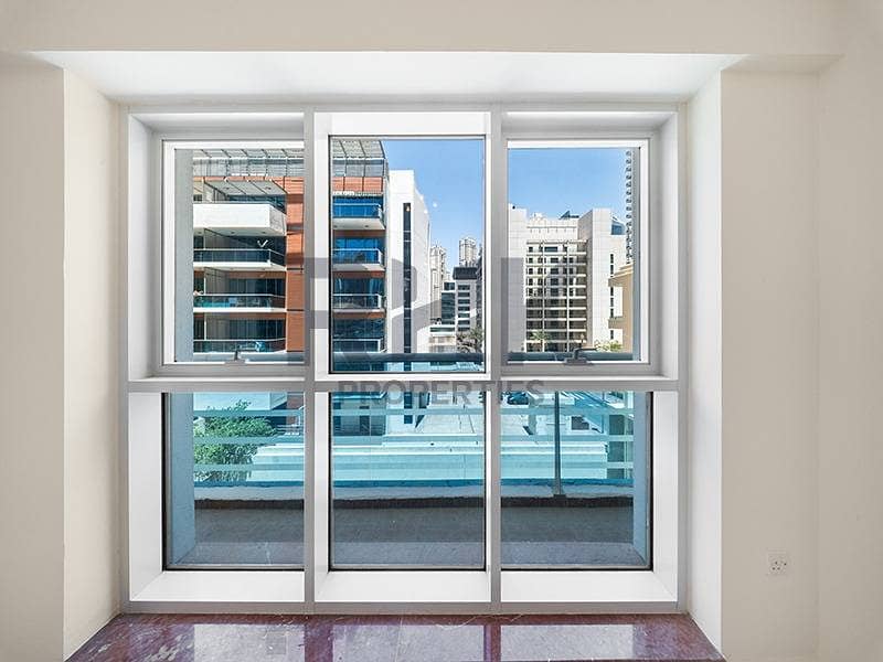 5 Living room window with pool and community view in Dubai Marina apartment