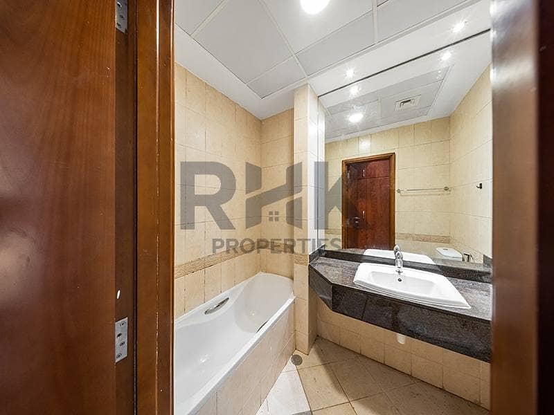 16 En-suite bathroom with bathtub and vanity in Dubai Marina apartment