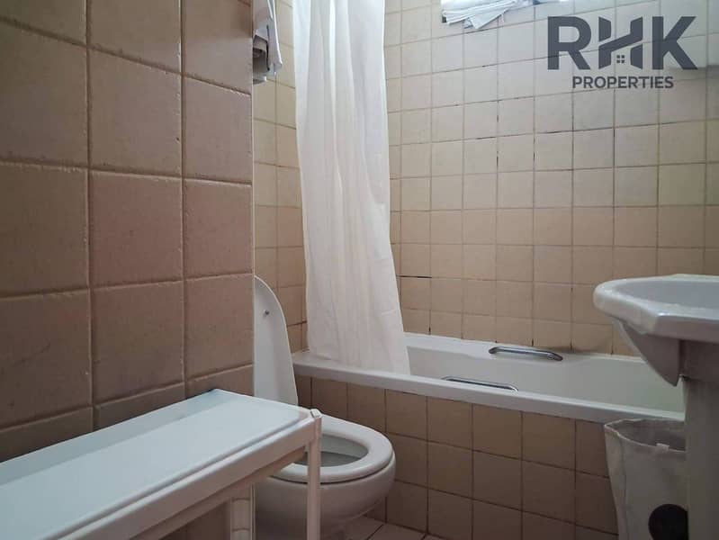 12 Glass balcony door with indoor plant in furnished Dubai Marina apartment