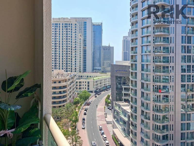 15 Marina skyline view from apartment balcony with high-rise towers and palm trees