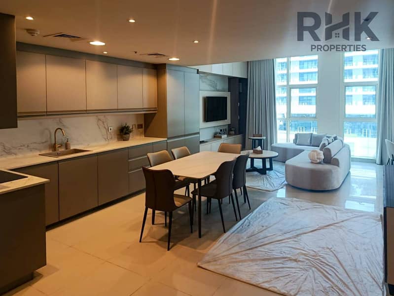 3 Open-plan kitchen with marble backsplash and living area in Dubai Marina luxury apartment