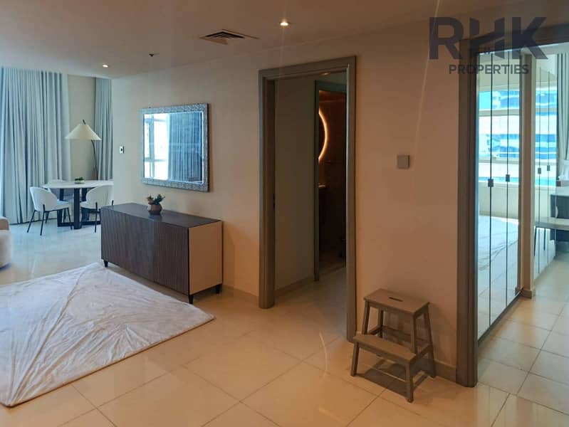 5 Entrance hallway with sideboard and mirror in furnished Dubai Marina apartment