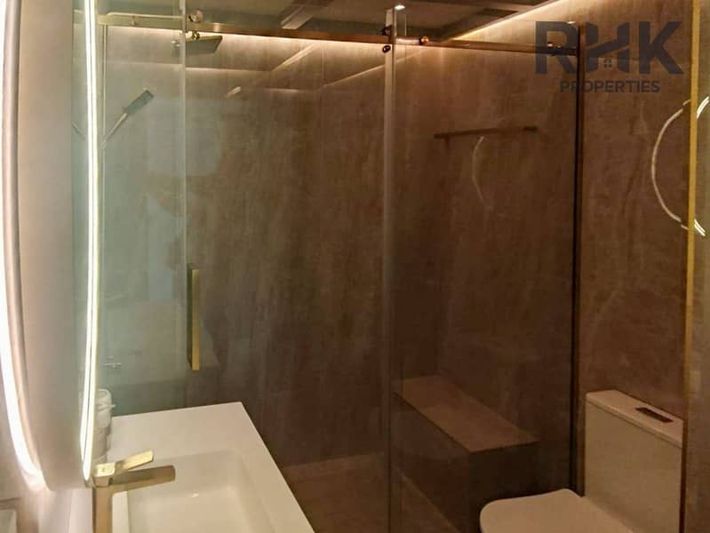 11 Walk-in rain shower with marble walls and glass enclosure in Dubai Marina apartment*