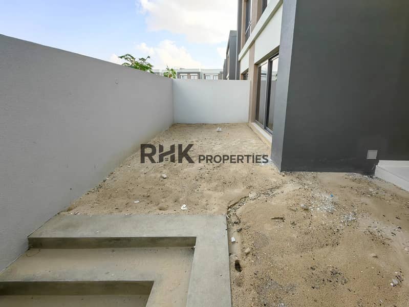 18 Bare landscaped private garden plot with boundary walls in new Dubai townhouse community