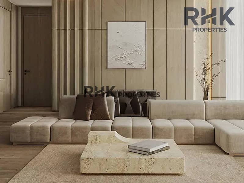 4 Modern studio apartment interior with wood-panel walls and neutral sofa in luxury Dubai tower