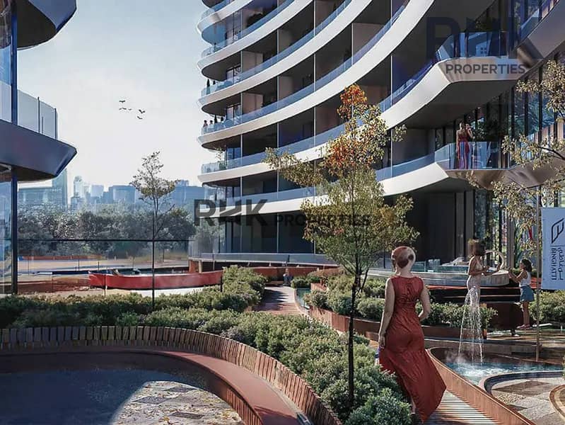 5 Curved glass facade of luxury Binghatti tower with landscaped water features in Dubai