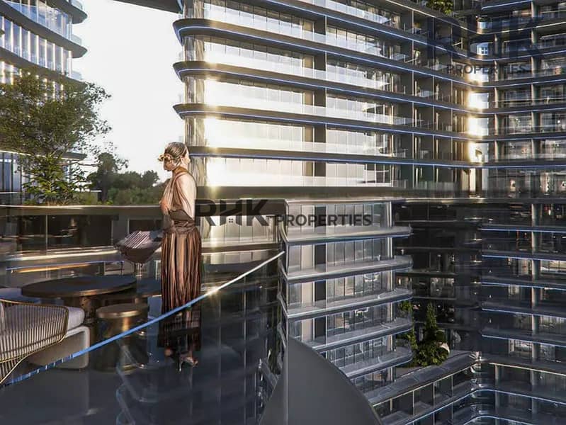 11 Woman on high-floor balcony overlooking luxury Dubai tower with city views