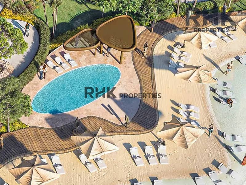 13 Aerial view of resort pool and beach lounge deck at luxury Dubai residence