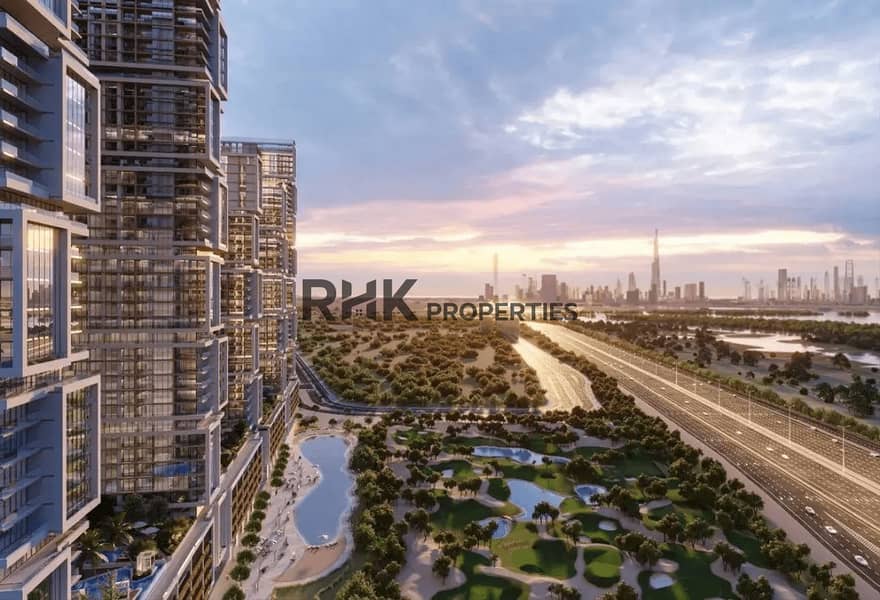 2 Sobha One tower overlooking golf course and Downtown Dubai skyline at sunset