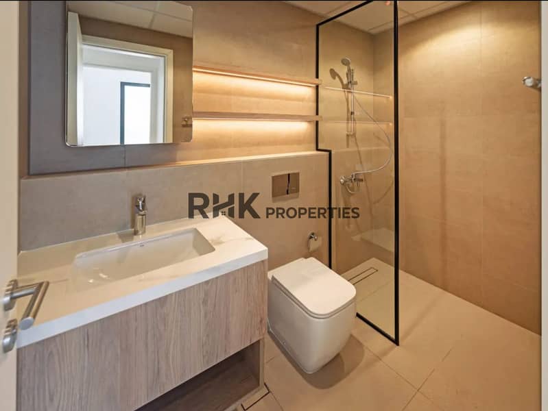 6 Modern bathroom with walk-in shower and vanity, Town Square Dubai rental apartment