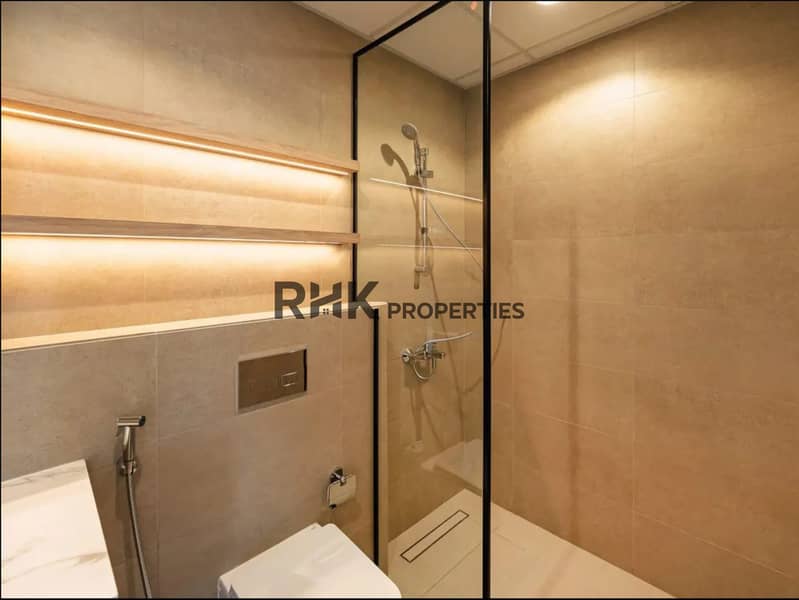 7 Walk-in rain shower with glass screen in Town Square Dubai apartment bathroom