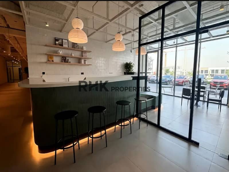 8 Residents cafe and coworking lounge amenity at Town Square Dubai community