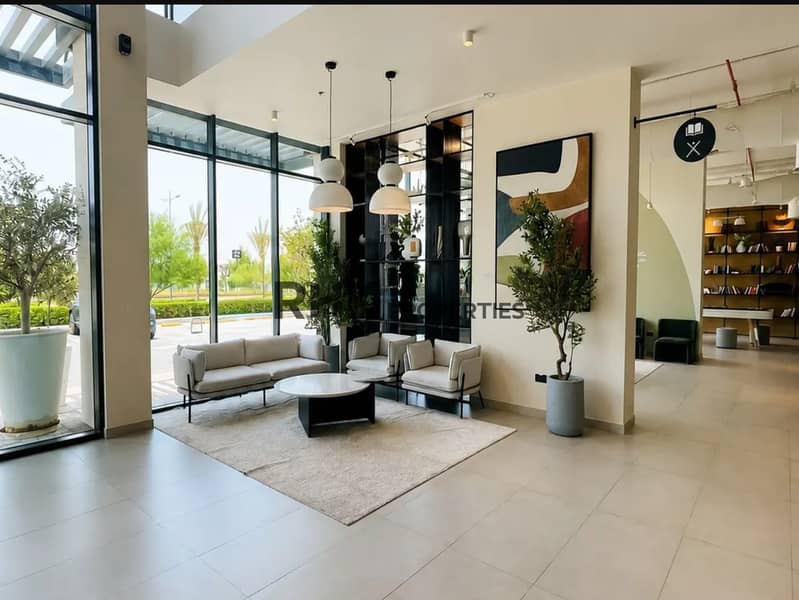 10 Furnished lobby lounge and library in Town Square Dubai residential building