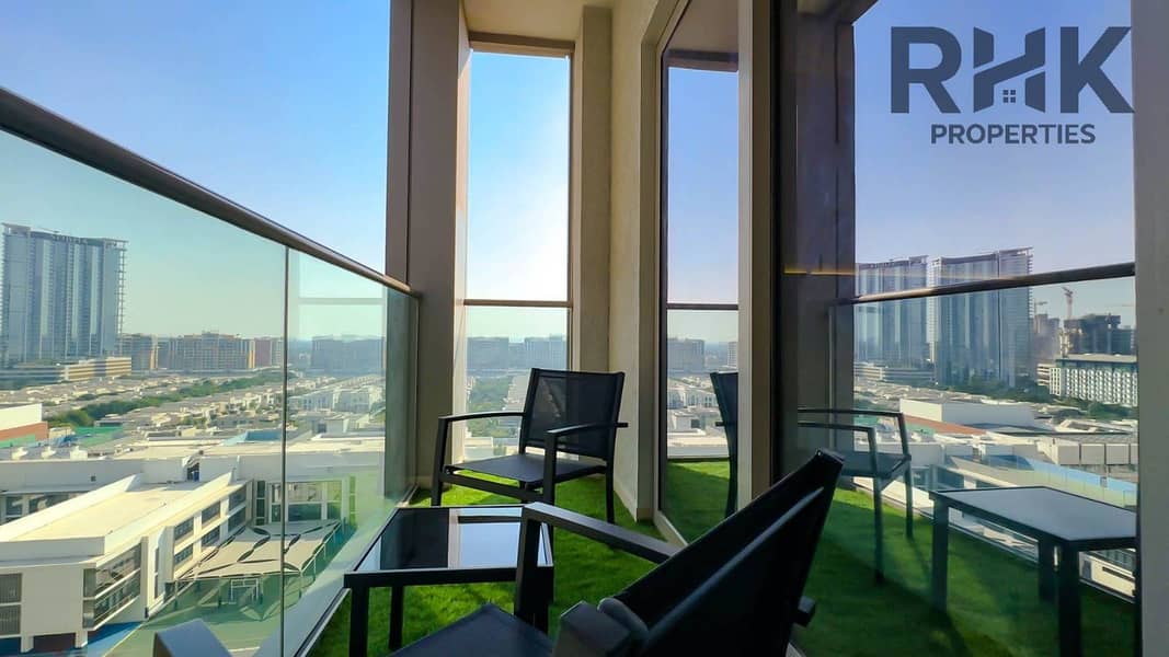 3 Corner balcony with city skyline views and outdoor seating in high-floor Dubai apartment