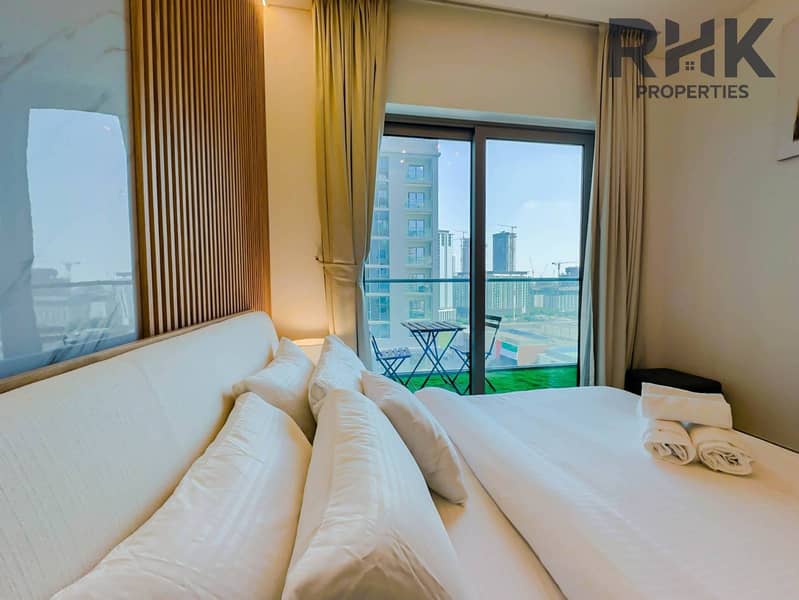 6 Bright bedroom with private balcony and community views in Dubai Creek Harbour apartment
