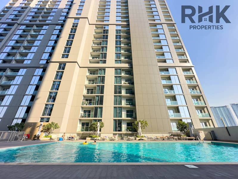 15 Outdoor swimming pool and residential tower facade at Dubai Creek Harbour community