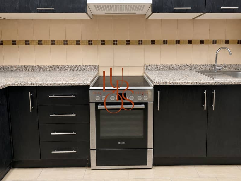 31 Marina_Apartment_12_Kitchen_Oven_Cabinetry. jpg