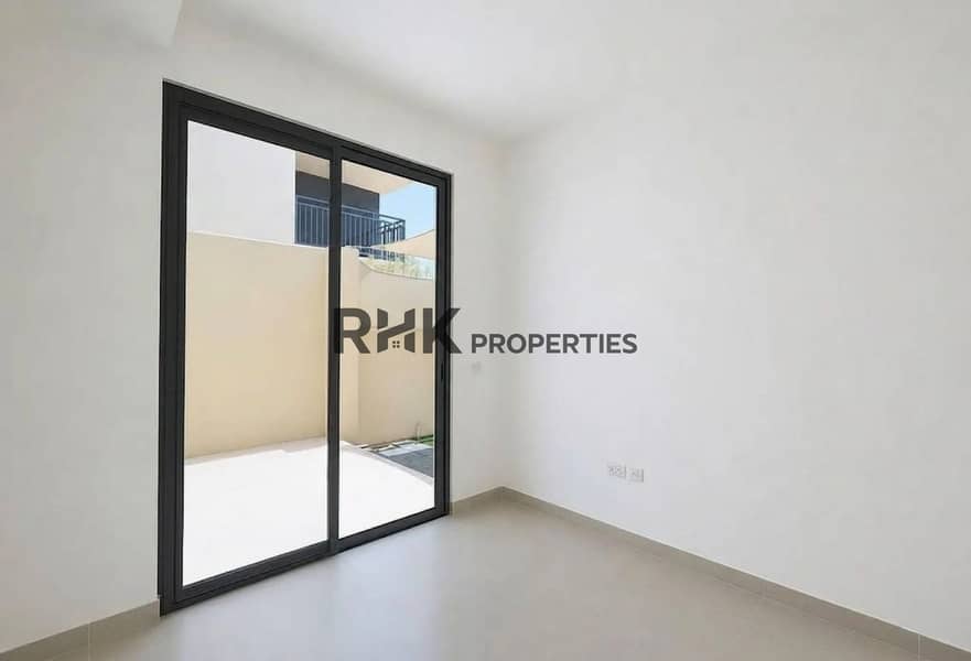 9 Sun-filled room with large sliding glass door leading to private courtyard in Dubai townhouse