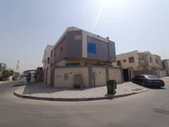 Villa for rent in Al Yasmeen: corner unit featuring 6 master bedrooms, a majlis, two living areas, a spacious kitchen, and a maid's room.