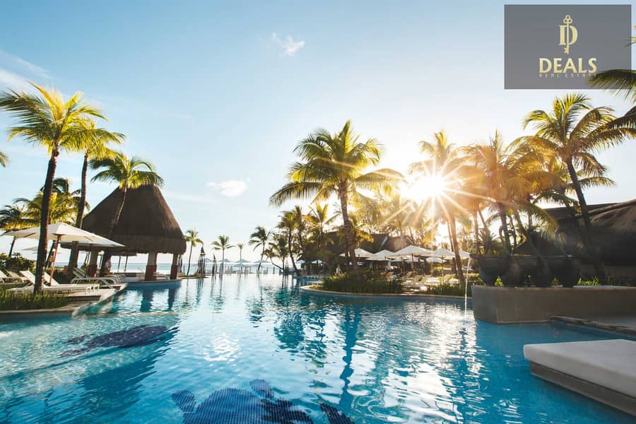 4 swimming-pool-among-palm-trees-on-a-tropical-islan-2022-02-12-05-47-40-utc. jpg