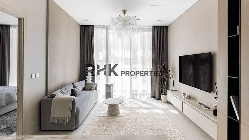 Luminar Tower Dubai living room with TV wall, sheer curtains and marble flooring Luminar Tower Dubai living room with TV wall, sheer curtains and marble flooring