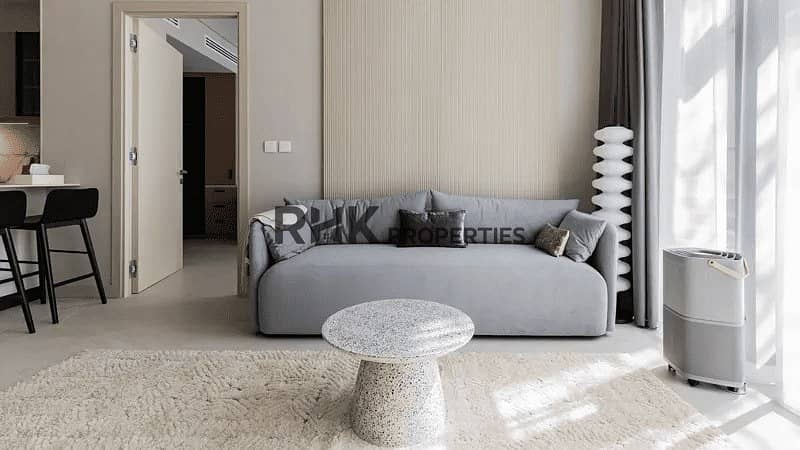 2 Luminar Tower Dubai apartment living room with minimalist grey sofa and natural light