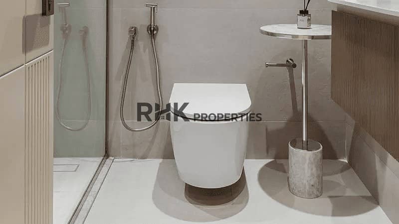 6 Luminar Tower Dubai bathroom with walk-in shower, wall-hung toilet and marble finishes